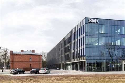 Socialinių mokslų kolegija (SMK) logo